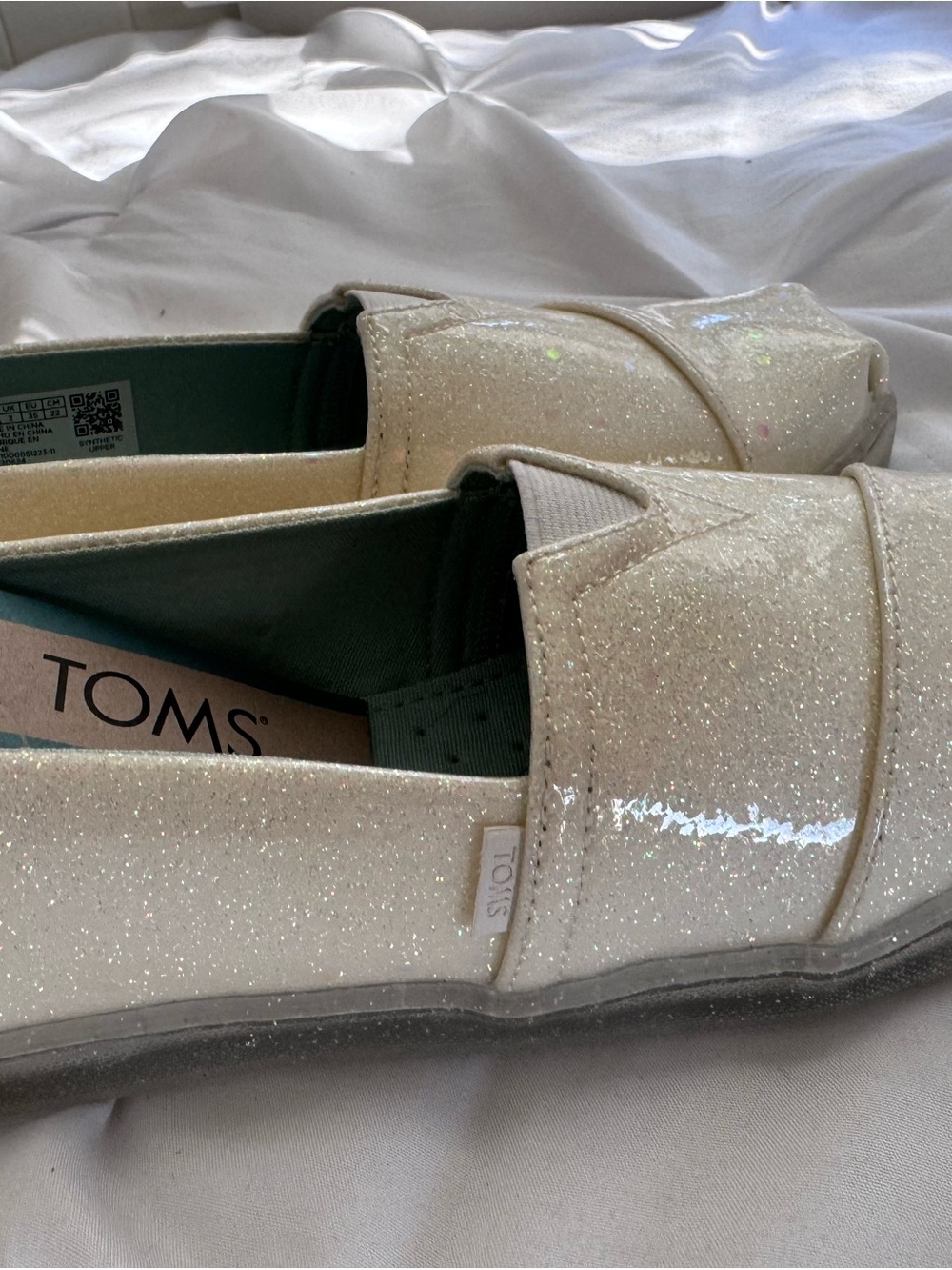TOMS girls Glitter Slip-On Shoes in Ivory